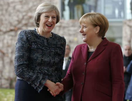 Britain's Prime Minister Theresa May is welcomed by German Chancellor Angela Merkel upon her arrival at the chancellery in Berlin, Germany, November 18, 2016. REUTERS/Fabrizio Bensch