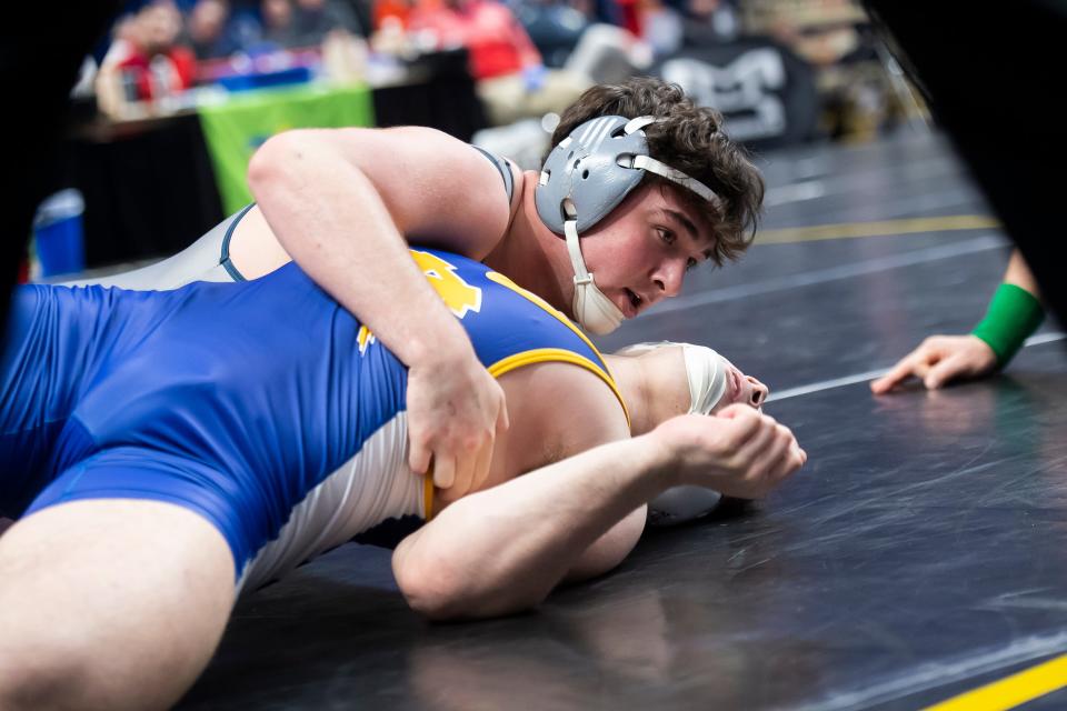 Chambersburg's Aiden Hight works to pin Canon-McMillan's Geno Calgaro in 74 seconds during a 215-pound first round bout at the PIAA Class 3A Wrestling Championships at the Giant Center on March 7, 2024, in Hershey.