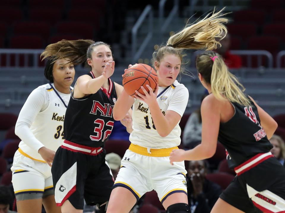 Kent State forward Bridget Dunn secures a rebound against Northern Illinois guard Laura Nickel (32) during the second half of the Mid-American Conference Tournament quarterfinals, Wednesday, March 13, 2024, in Cleveland.