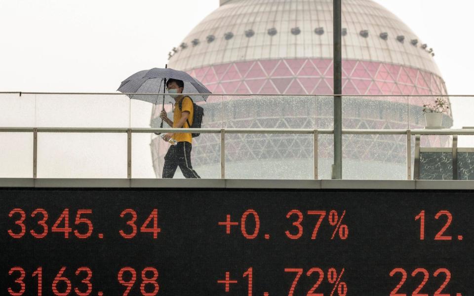 A pedestrian in Shanghai  - ALEX PLAVEVSKI/EPA-EFE/Shutterstock