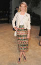 The “Mad Men” actress’s multi-colored embroidered Burberry skirt paired with a white T-shirt, and matching cross-body bag complimented her pink hair perfectly.