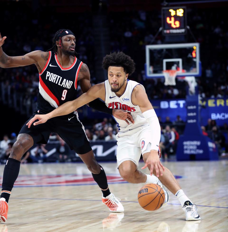 Detroit Pistons guard Cade Cunningham (2) drives against Portland Trail Blazers forward Jerami Grant (9) during second-quarter action at Little Caesars Arena in Detroit on Wednesday, Nov. 1, 2023.