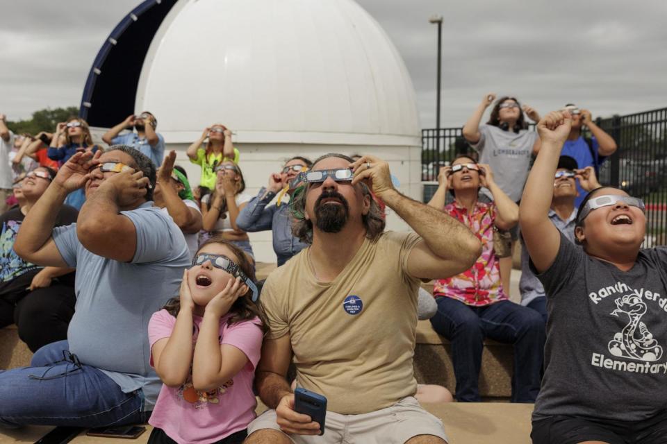 PHOTO: People watch the Annular Solar Eclipse using safety glasses in Brownsville, Texas on Oct. 14, 2023.  (Mike Gonzalez/Anadolu via Getty Images, FILE)