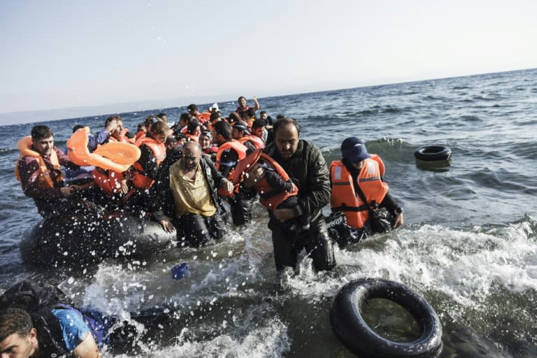 Syrian refugees arrive on Lesbos island on August 23, 2015