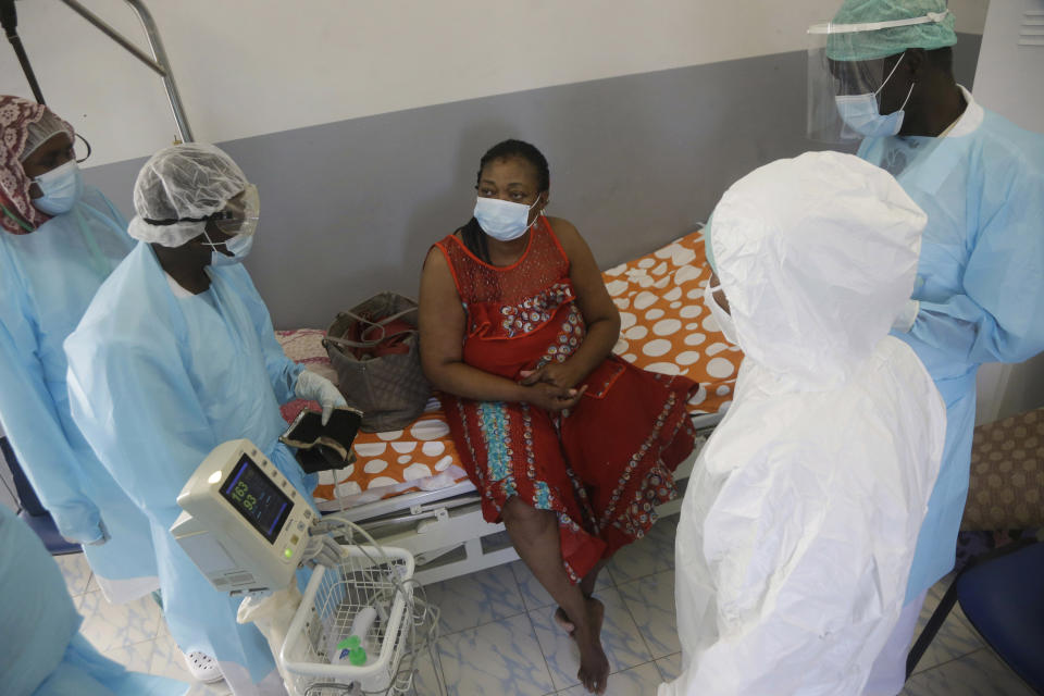 A COVID-19 patient speaks to medical staff, at the Farcha provincial hospital in N'Djamena, Chad, Friday April 30, 2021. While the world's wealthier nations have stockpiled coronavirus vaccines for their citizens, many poorer countries are scrambling to secure enough doses, and some, like Chad, have yet to receive any. (AP Photo/Sunday Alamba)