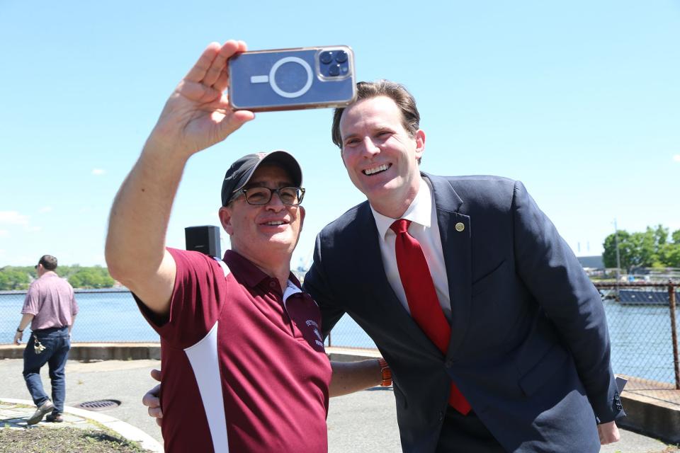 Steve Cirillo, who has worked in Portsmouth schools for 35-plus years, takes a selfie with Mayor Deaglan McEachern following the Burial at Sea ceremony May 24, 2024. The mayor thanked Cirillo for leading the middle school band during the ceremony one more time before retiring in June.