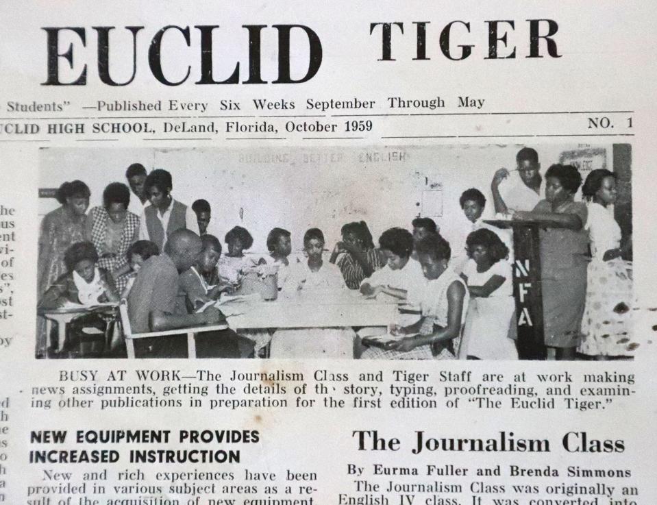 Joyce Cusack is standing second from the right, in the dark dress, in this 1960 photograph in the Euclid School student newspaper, The Euclid Tiger. Cusack was the managing editor of the newspaper.