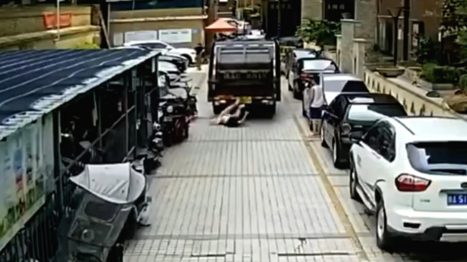 The woman being run over by the garbage truck. Source: AsiaWire/Australscope