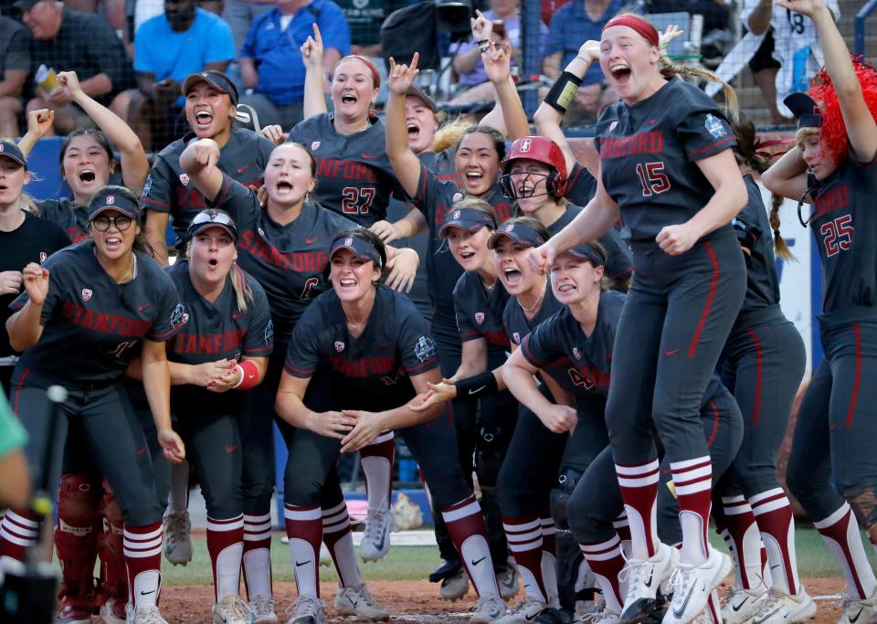 Stanford celebrates the home run by Sydney Steele (32) in the seventh inning during a softball game between Alabama and Stanford in the Women's College World Series at USA Softball Hall of Fame Stadium in  in Oklahoma City, Friday, June, 2, 2023. 