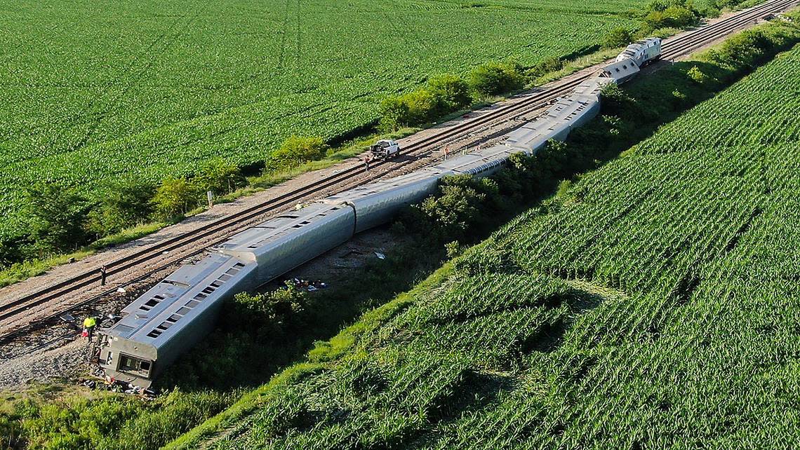 Several passenger cars and the engines of an Amtrak train rest on their sides after the train hit a truck at a crossing June 27 near Mendon, Missouri. Four people died in the accident, three passengers and the truck driver, and about 150 were injured.