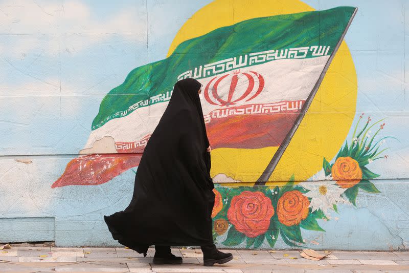 Women walk after morality police shut down in Tehran