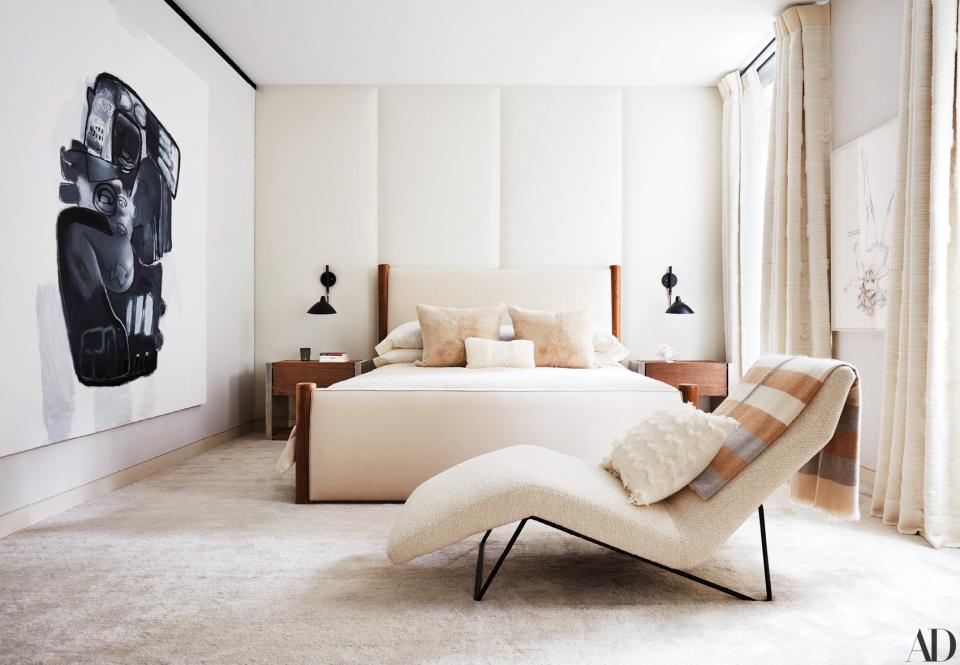 In the master bedroom, a Chapas textiles fabric covers a vintage Carlo Hauner chaise longue, and a Kohro fabric covers the Jacques Adnet bed. The custom side tables are by Ingrao in collaboration with Based Upon; artworks by Richard Prince (left) and Lutz Bacher.