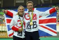 2016 Rio Olympics - Cycling Track - Victory Ceremony - Men's Keirin Victory Ceremony - Rio Olympic Velodrome - Rio de Janeiro, Brazil - 16/08/2016. Gold medalist Jason Kenny (GBR) of Britain poses with his gilfriend, women's omnium gold medalist Laura Trott (GBR) of Britain. REUTERS/Matthew Childs
