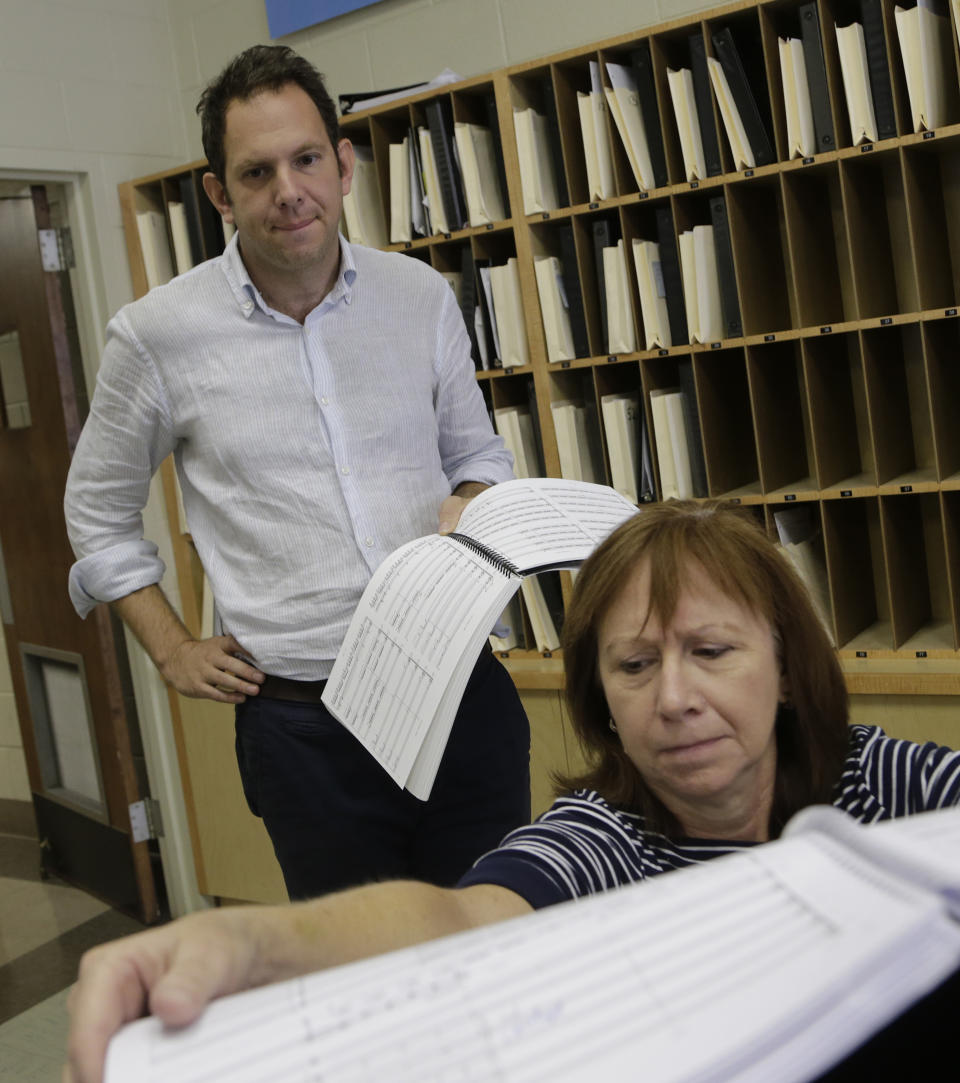 Composer Yotam Haber works during a rehearsal for his symphony "A More Convenient Season" in Birmingham, Ala., Saturday, Sept. 7, 2013. Rather than focus in a literal way on the Sept. 15, 1963, Ku Klux Klan bombing that killed four little black girls on their way to Sunday school, the Dutch-born composer sought to evoke Birmingham's role in the larger civil rights struggle. (AP Photo/Dave Martin)