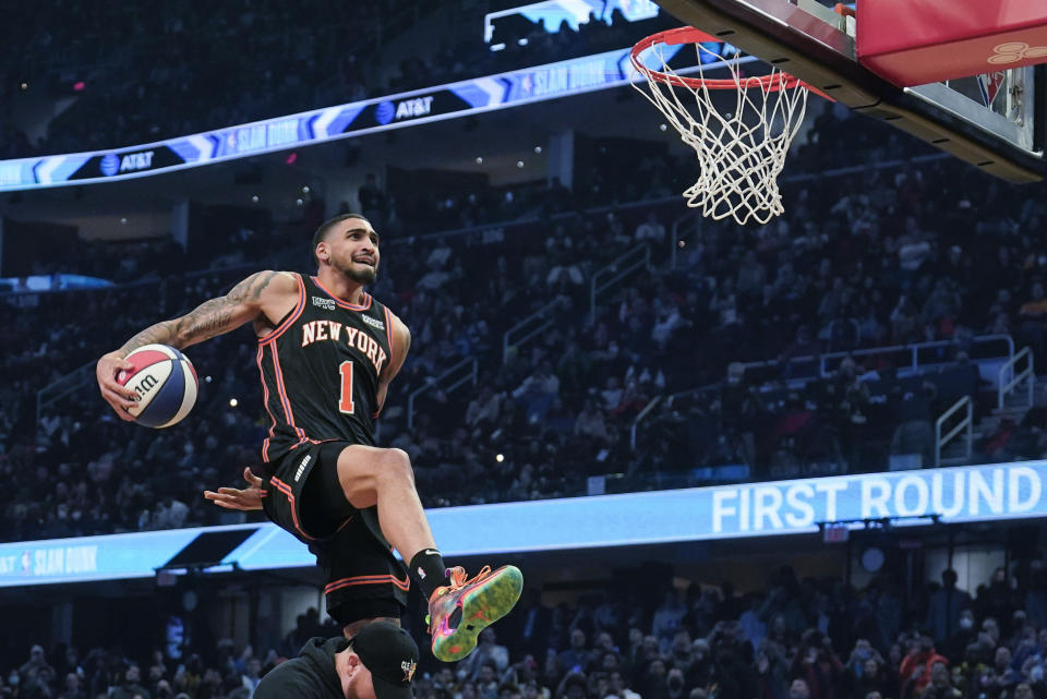 New York Knicks Obi Toppin leaps towards the basket during the dunk contest part of the skills challenge competition, part of NBA All-Star basketball game weekend, Saturday, Feb. 19, 2022, in Cleveland. (AP Photo/Charles Krupa)