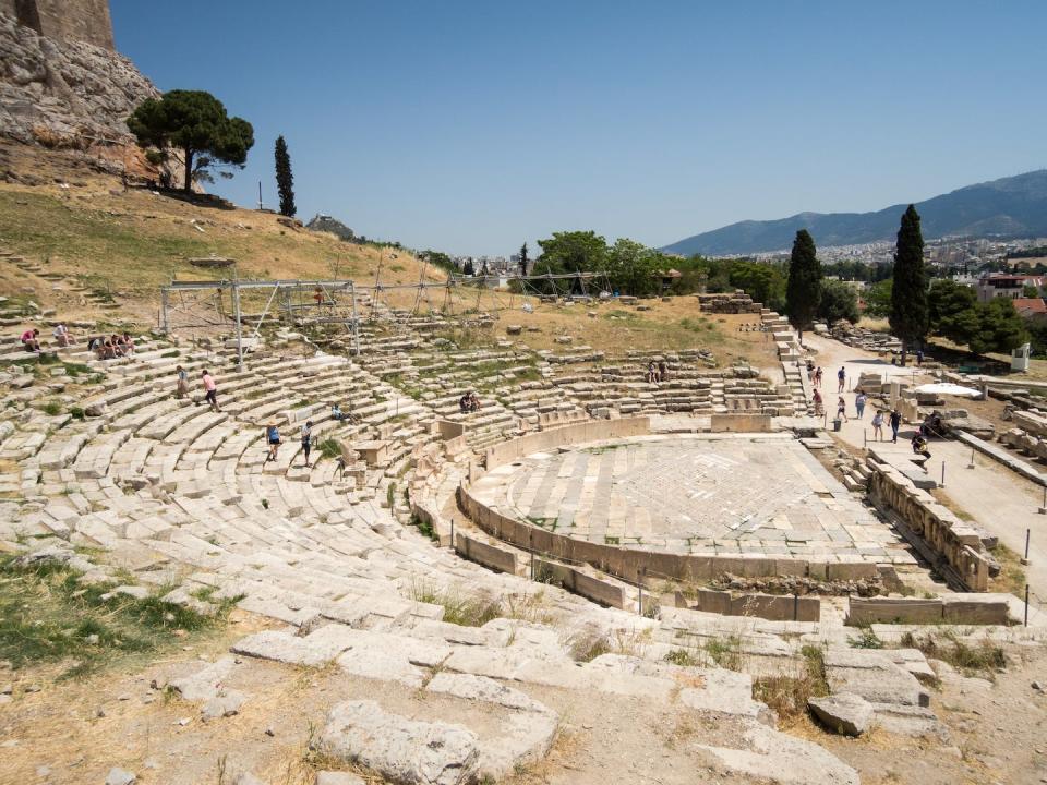 The Theater of Dionysus in Athens could hold thousands of spectators for shows subsidized by liturgists. <a href="https://en.wikipedia.org/wiki/Theatre_of_Dionysus#/media/File:Athen_Akropolis_(18512008726).jpg" rel="nofollow noopener" target="_blank" data-ylk="slk:dronepicr via Wikimedia Commons;elm:context_link;itc:0;sec:content-canvas" class="link ">dronepicr via Wikimedia Commons</a>, <a href="http://creativecommons.org/licenses/by/4.0/" rel="nofollow noopener" target="_blank" data-ylk="slk:CC BY;elm:context_link;itc:0;sec:content-canvas" class="link ">CC BY</a>