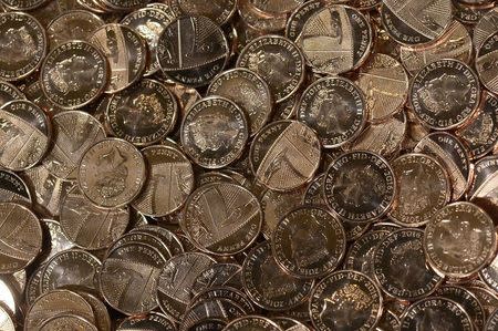 New one pence coins are seen at The Royal Mint, in Llantrisant, Wales, Britain, January 25, 2017. Picture taken January 25, 2017. REUTERS/Rebecca Naden