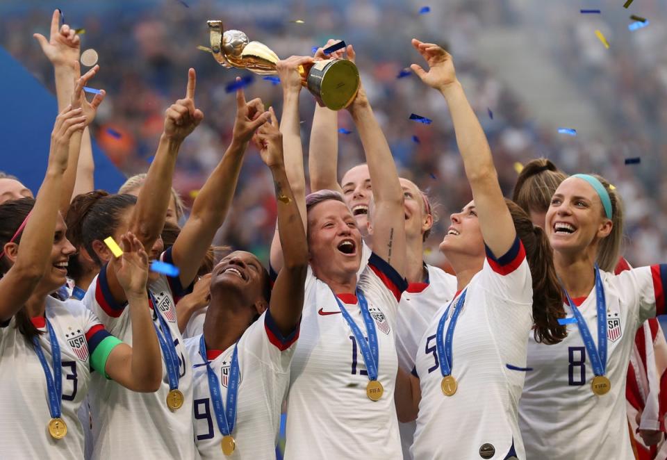 Megan Rapinoe lifts the Women’s World Cup in summer 2019 (AP)