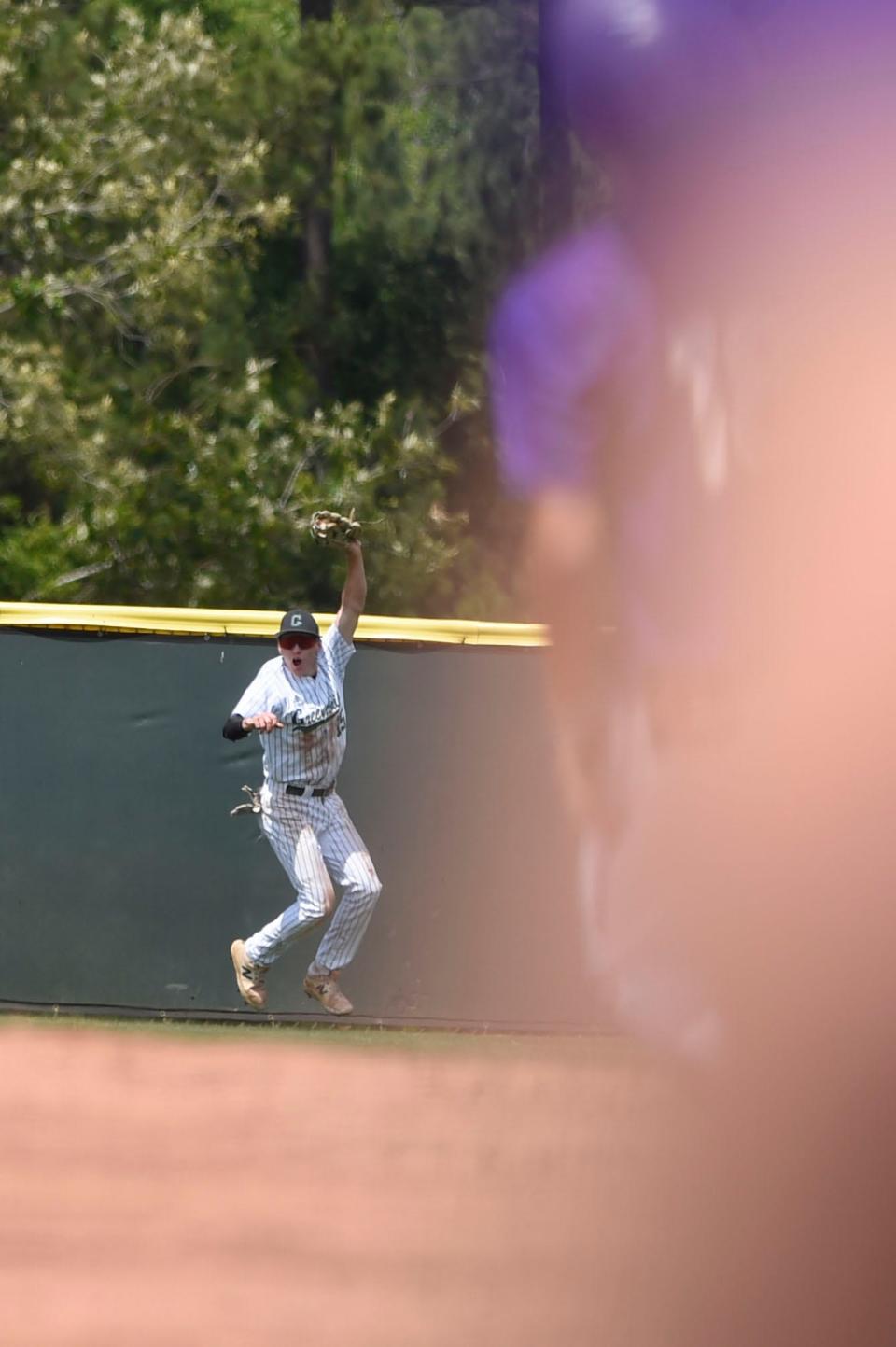 Greenbrier outfielder Jamie Daly (15) catches a fly ball during the Greenbrier and Cartersville 5A state playoff game at Greenbrier High School on Saturday, May 6, 2023. Cartersville defeated Greenbrier 4-3 in the first game of their double-header. 