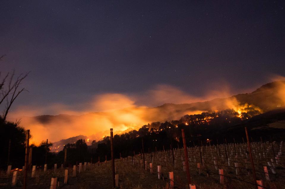 Fire glows on a hillside in Napa