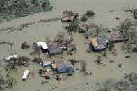 Buildings and homes are flooded in the aftermath of Hurricane Laura Thursday, Aug. 27, 2020, near Lake Charles, La. (AP Photo/David J. Phillip)