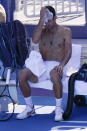 Novak Djokovic, of Serbia, rest between games against Pablo Carreno Busta, of Spain, during the bronze medal match of the tennis competition at the 2020 Summer Olympics, Saturday, July 31, 2021, in Tokyo, Japan. (AP Photo/Seth Wenig)