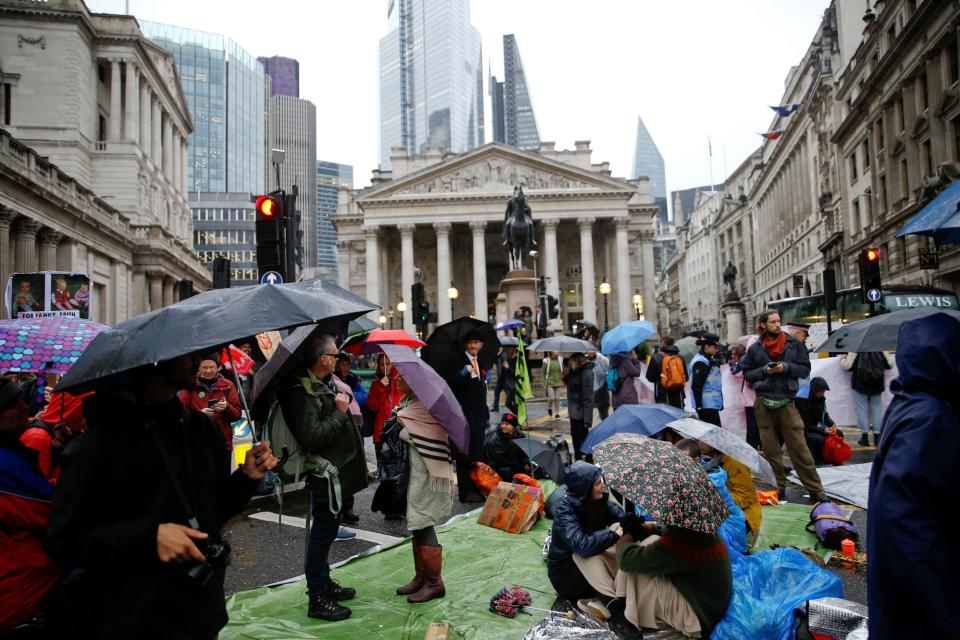 Protesters block the road at Bank. (REUTERS)