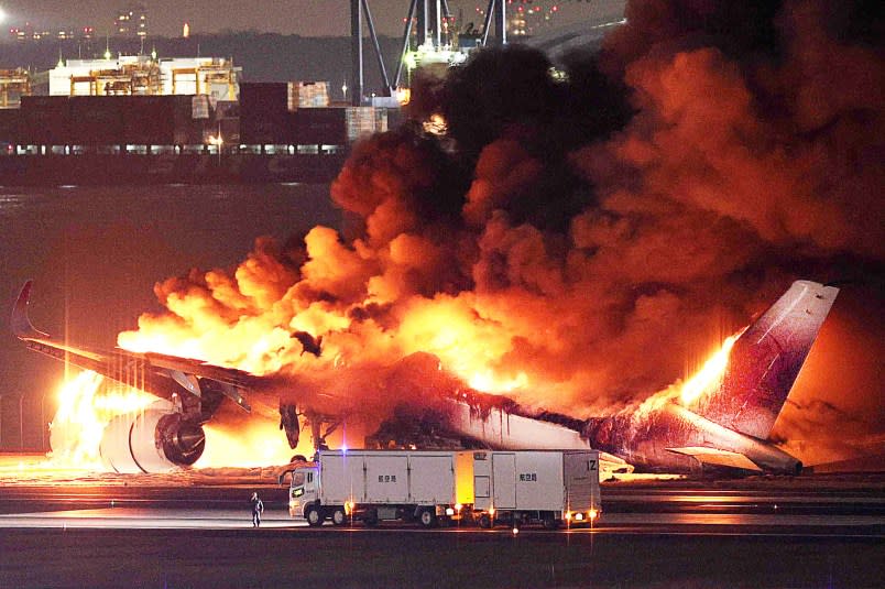 TOPSHOT – This photo provided by Jiji Press shows a Japan Airlines plane on fire on a runway of Tokyo’s Haneda Airport on January 2, 2024. A Japan Airlines plane was in flames on the runway of Tokyo’s Haneda Airport on January 2 after apparently colliding with a coast guard aircraft, media reports said. (Photo by JIJI PRESS / AFP) / Japan OUT (Photo by STR/JIJI PRESS/AFP via Getty Images)