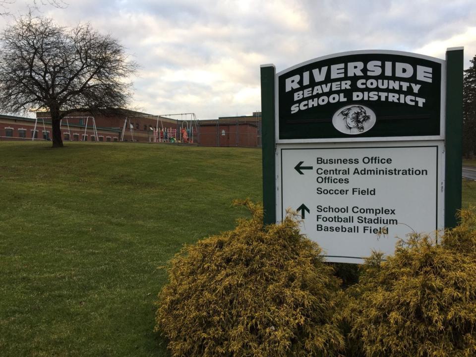 A sign directing visitors around the Riverside School District campus.