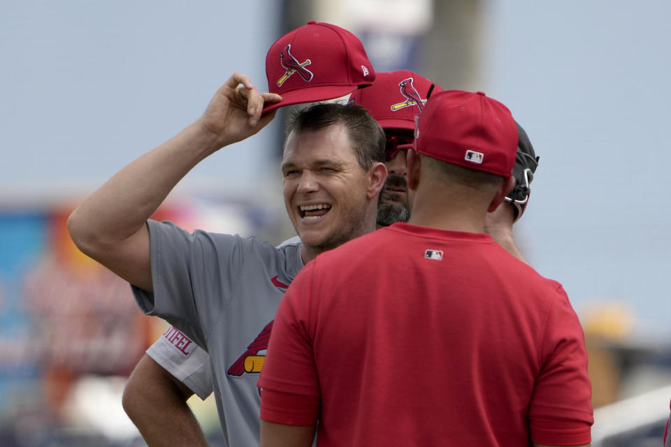 St. Louis Cardinals starting pitcher Sonny Gray, left, talks on the mound manager Oliver Marmol before being removed during the second inning of a spring training baseball game against the Washington Nationals Monday, March 4, 2024, in West Palm Beach, Fla. The team announced that Gray was removed due to tightness in his right hamstring. (AP Photo/Jeff Roberson)