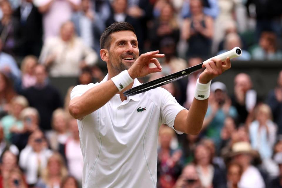 Djokovic plays the violin after defeating Lorenzo Musetti in the semifinals (Getty Images)