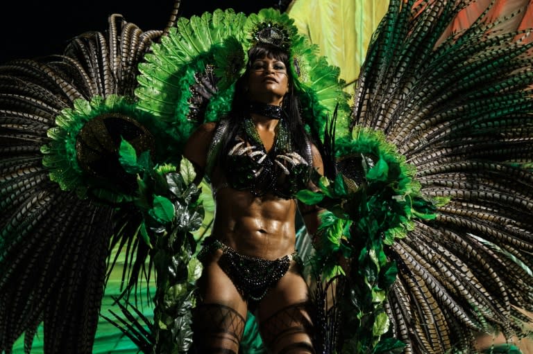 A reveller performs with the Imperatriz Leopoldinense samba school on the first night of Rio Carnival, at the Sambadrome, early on February 27, 2017