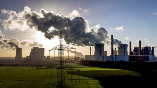 Steam rises from the coal-fired power plant.