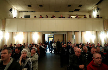 Voters listen to a speech by the Chairman of the Hungarian right wing opposition party Jobbik Gabor Vona at a campaign forum in Marcali, Hungary, March 16, 2018. Picture taken March 16, 2018. REUTERS/Bernadett Szabo