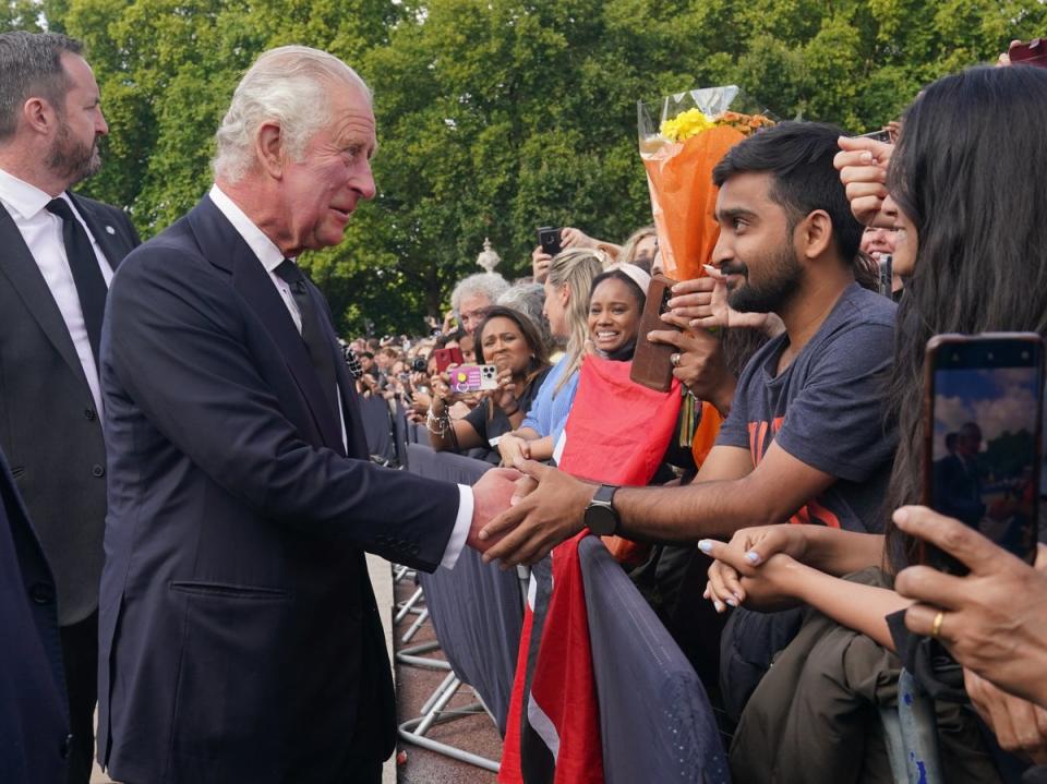 The King is greeted by well-wishers (Yui Mok/PA) (PA Wire)