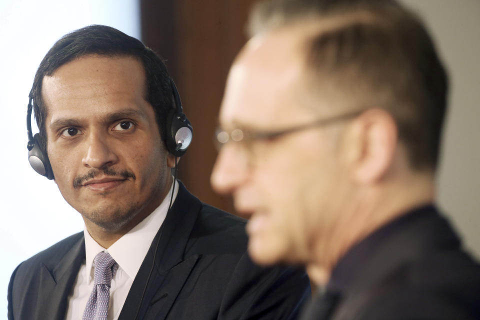 Qatar's Foreign Minister Sheikh Mohammed bin Abdulrahman Al Thani, left, and German Foreign Minister Heiko Maas, right, address the media after a meeting at the foreign office in Berlin, Germany, Wednesday, March 4, 2020. (Wolfgang Kumm/dpa via AP)