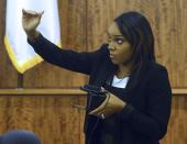 Shayanna Jenkins, fiancee of former NFL player Aaron Hernandez gestures during testimony in his murder trial in Fall River Massachusetts, March 30, 2015. Jenkins said she disposed of a cardboard box from their Massachusetts home at his request the day after prosecutors say he fatally shot an associate. REUTERS/Ted Fitzgerald/Pool