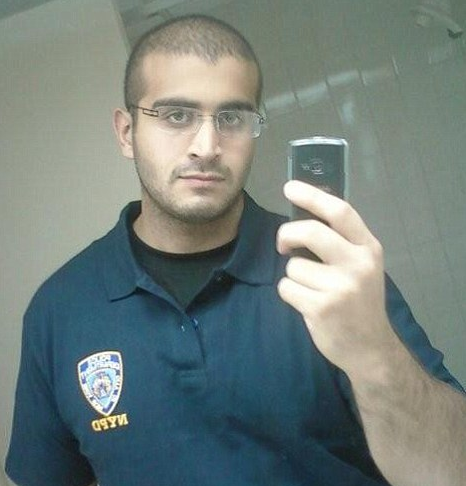 Omar Mateen is seen taking selfies and wearing New York Police Department shirts.