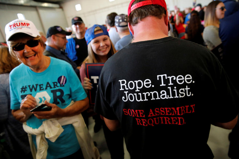 A man wears a shirt reading "Rope. Tree. Journalist." as supporters gather to rally with Republican presidential nominee Donald Trump in a cargo hangar at Minneapolis Saint Paul International Airport in Minneapolis, Minnesota, U.S. November 6, 2016. REUTERS/Jonathan Ernst     TPX IMAGES OF THE DAY     