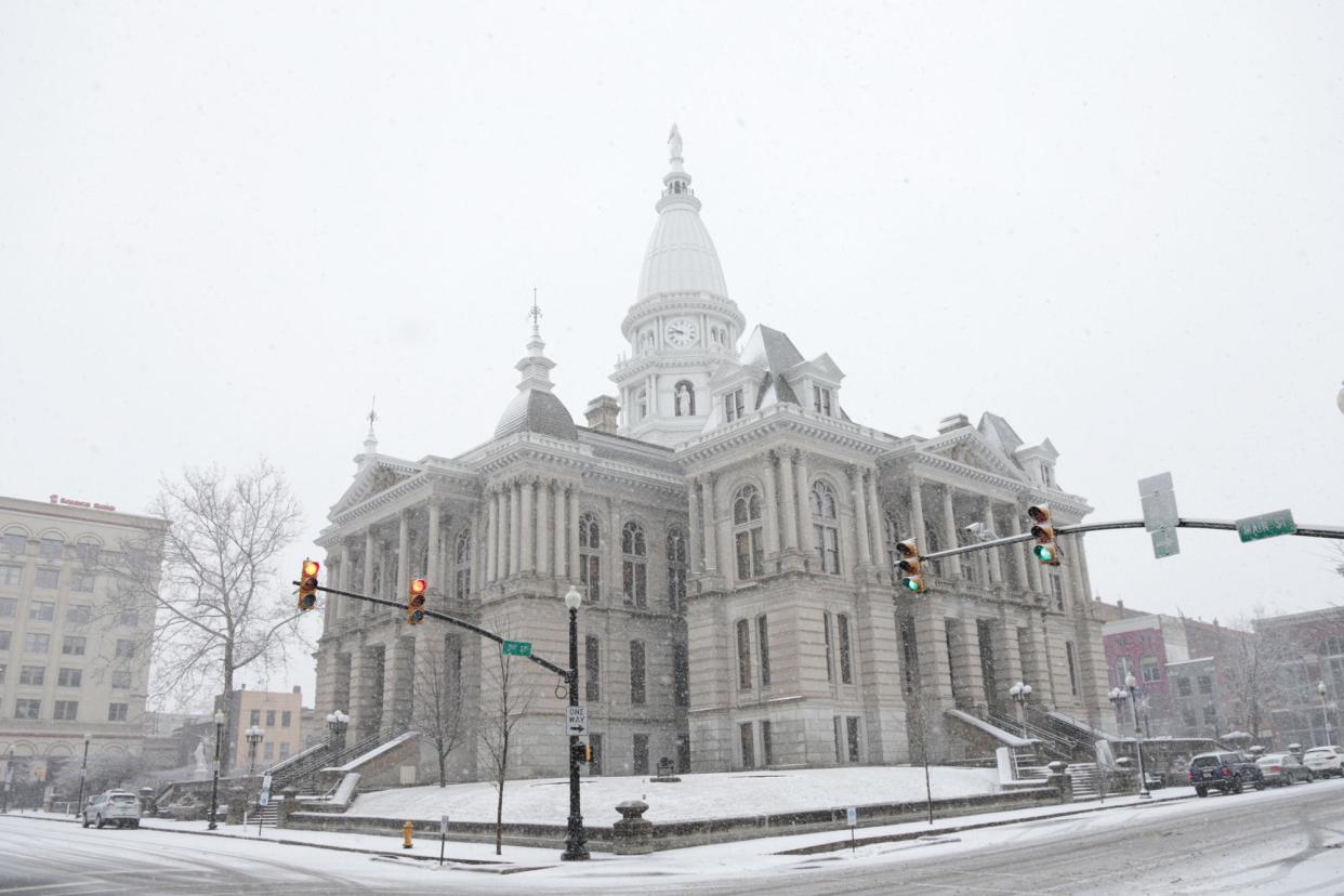 Snow begins to fall outside the Tippecanoe County Courthouse in Lafayette, Wednesday, Feb. 2, 2022.