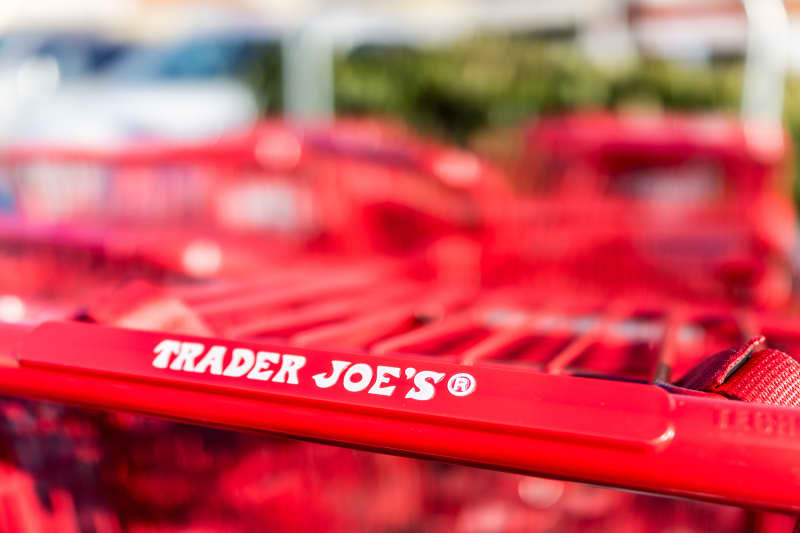 Red shopping carts with Trader Joes store sign on handle
