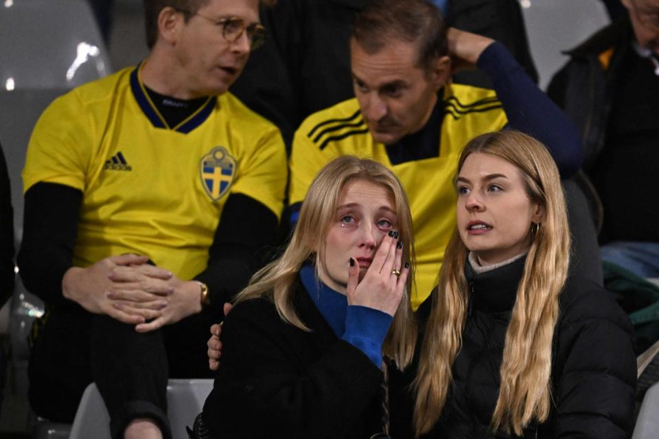 Swedish supporters react as they wait in the stand during the Euro 2024 qualifying football match between Belgium and Sweden at the King Baudouin Stadium in Brussels (AFP via Getty Images)