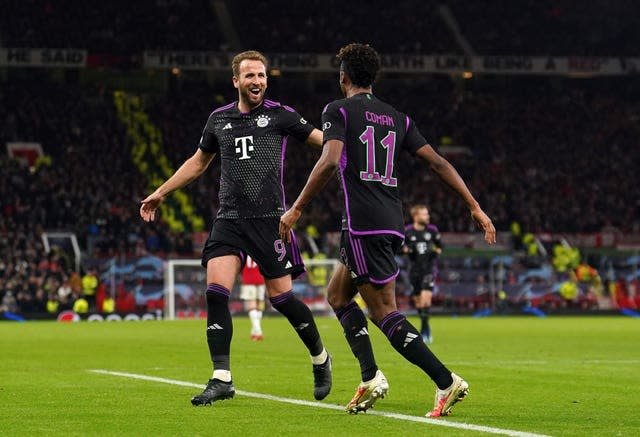 Kingsley Coman celebrates his winner with team-mate Harry Kane, left