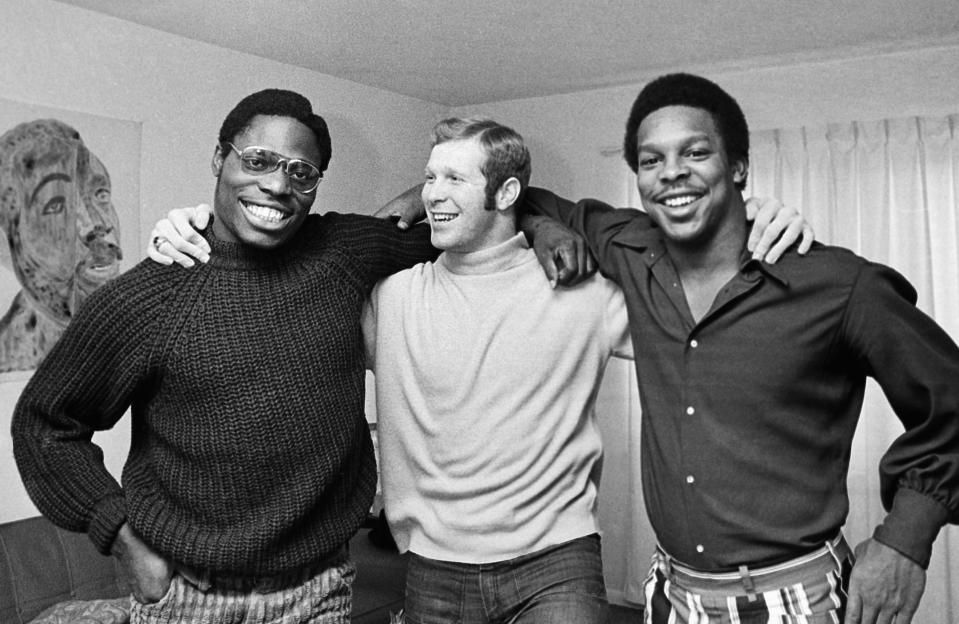 FILE - Ohio State quarterback Rex Kern, center, stands with running backs John Brockington, left, and Leo Hayden in January 1971 in Columbus, Ohio. Brockington was drafted by the Green Bay Packers, and Hayden by the Minnesota Vikings. Brockington, a former All-Pro fullback who ranks fourth on the Packers’ career rushing list, has died. He was 74. The Packers announced Brockington died Friday, March 31, 2023, in San Diego. (AP Photo/Gene Herrick, File)
