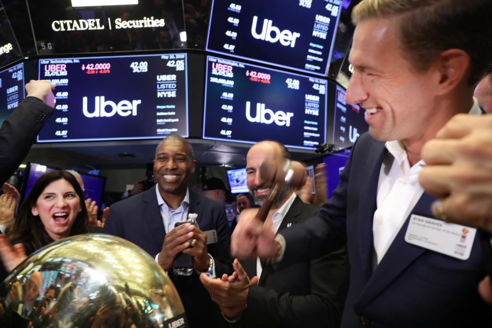 Uber’s much heralded debut on the New York Stock Exchange began with disappointment on Friday as its shares fell below an already reduced offering price.The taxi firm’s stock opened 7 per cent lower than planned at $42 after the opening bell on Wall Street, before beginning to climb as trading got underway.Still, that means Uber is still worth around $80bn despite never having turned a profit and warning last month that it might never do so. Uber lost $3bn last year and $9bn since it was founded - large even by the standards of Silicon Valley tech startups.But it managed to pull off the third-largest US stock market float in history, behind only Facebook and Chinese e-commerce firm Alibaba. The share sale gives Uber another $8.1bn of cash to fund its global expansion plans.While the feat will no doubt be seen as a triumph for Uber, its valuation is a third lower than the $120bn that investment bankers had said the company was worth just last year. That was then lowered to $90bn when Uber made its offering document available to investors last month, before a further reduction to $82bn this week.A host of regulatory battles, increasing disquiet from drivers about pay and workers' rights, along with doubts about the ability of ride-hailing firms to make money have lowered the hefty price tag. Uber’s closest rival Lyft has seen its shares tank since listing six weeks ago.Meanwhile, jitters about an intensifying trade battle between China and the US have prompted caution among investors. All major share indices fell on Friday after the world’s two largest economies failed to reach a deal on tariffs which had hoped to be wrapped up this week.Uber co-founders Travis Kalanick and Garrett Camp were present at the NYSE but absent from the podium as the opening bell was rung by one of the company’s first employees. The pair cashed out more than $300m between them on Friday by selling small slices of their respective stakes. Both retained the majority of their shares and became billionaires in an instant, with Mr Kalanick’s stake worth around $5bn.Questions will remain about Uber’s profitability but its eye-watering valuation is based on rapid growth above all else. Revenues surged 42 per cent last year to $11.3bn on the back of a staggering 5.2 billion trips on its taxi and Uber Eats food delivery service.Chief executive Dara Khosrowshahi told CNBC that Uber investors are in it for the long haul. “Today is only one day. I want this day to go great, but it's about what we build in the next three to five years,” he said in an interview with CNBC. “And I feel plenty of pressure to build over that time frame.” Uber is dealing with a potential $12 trillion market, Mr Khosrowshahi said.He predicted that younger generations will not want to own cars. “I think more and more you're going to have transportation on demand services, essentially de-bundle the car. They're going to want to push a button and get the transportation they want.” The company envisages itself as a logistics company; an Amazon of transport. But it will have to deal with a number of problems before that vision is realised, particularly its treatment of drivers, many of whom protested ahead of Friday’s IPO to show their dissatisfaction with the deal they are getting.