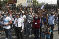 FILE - This Wednesday, July 29, 2020 file photo, dozens of Palestinians flash the victory sign as they protest against their permanent settlement in Lebanon and demanding immigration, near the U.S. embassy in Aukar, northeast of Beirut, Lebanon. The financial crisis that the U.N. agency for Palestinian refugees is experiencing could lead to ceasing some of its activities in what would raise risks of instability in this volatile region, the head of the agency said Wednesday, Sept. 16. (AP Photo/Bilal Hussein, File)