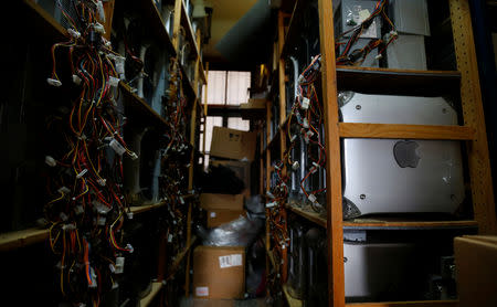 Power Macs sit on the shelves in the office of Austrian Apple computer collector Roland Borsky in Vienna, Austria September 28, 2018. REUTERS/Leonhard Foeger