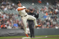 San Francisco Giants third baseman Matt Chapman throws to first base on a single hit by New York Mets' Francisco Lindor during the first inning of a baseball game in San Francisco, Wednesday, April 24, 2024. (AP Photo/Jeff Chiu)