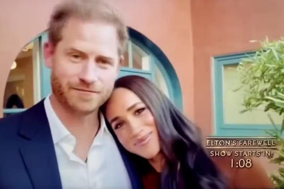 Meghan cosied up to her husband at the end of the touching video (Handout)