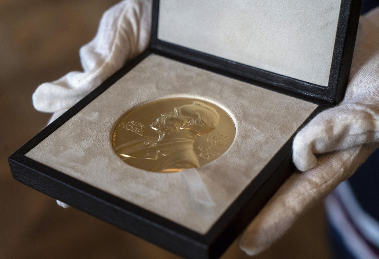 FILE - A Tuesday, Dec. 8, 2020 file photo of a Nobel Prize medal. The Nobel Peace Prize will be awarded on Friday Oct. 8, 2021.(AP Photo/Jacquelyn Martin, File)